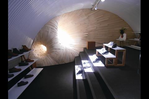 The principal feature of this area is an artfully lit wooden sculpture at the far end that takes the eye through the whole of the space.